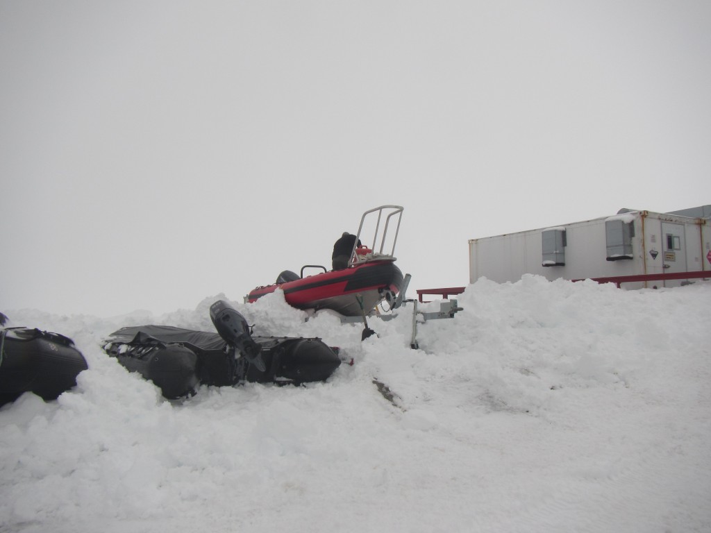 Anomalously high precipitation this winter means mountains of snow covering everything here on station... including the small boats! Jack (one of the marine technicians) is busy digging.