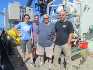 The Vent-SID group (Nuria Fernandez Gonzalez, Jeremy Rich, Craig Taylor, and Stefan Sievert) in front of the instrument they tested at sea for the first time