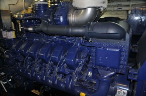 This is one of the two smaller 12 cylinder engines. The other pair have 16; each is attached to a generator and can be called upon as needed to supply power to the ship