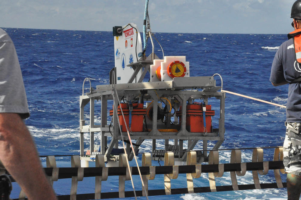 The DeepTow sled, carrying two magnetometers, is deployed overboard off the a-frame