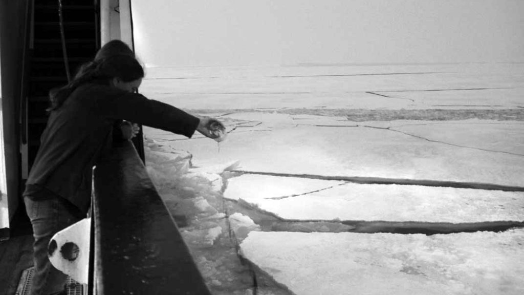Maren pours a glass of port in offering to the ocean for a favorable last CTD tow-yo. But if one pours port out to starboard at sea, should one also pour Madeira out to port? (photo by Chris German, Woods Hole Oceanographic Institution)
