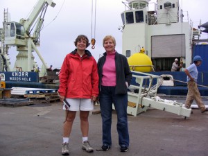 Amy Bower and Kate Fraser stand in front of R/V Knorr before departing on the cruise. (Photo by Terry McKee, Woods Hole Oceanographic Institution)