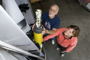 Amy Bower and Jim Valdes check out a Profiling Float. (Photo by Tom Kleindinst, Woods Hole Oceanographic Institution)
