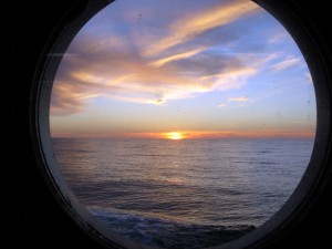 Sunset through a port hole. (Woods Hole Oceanographic Institution)