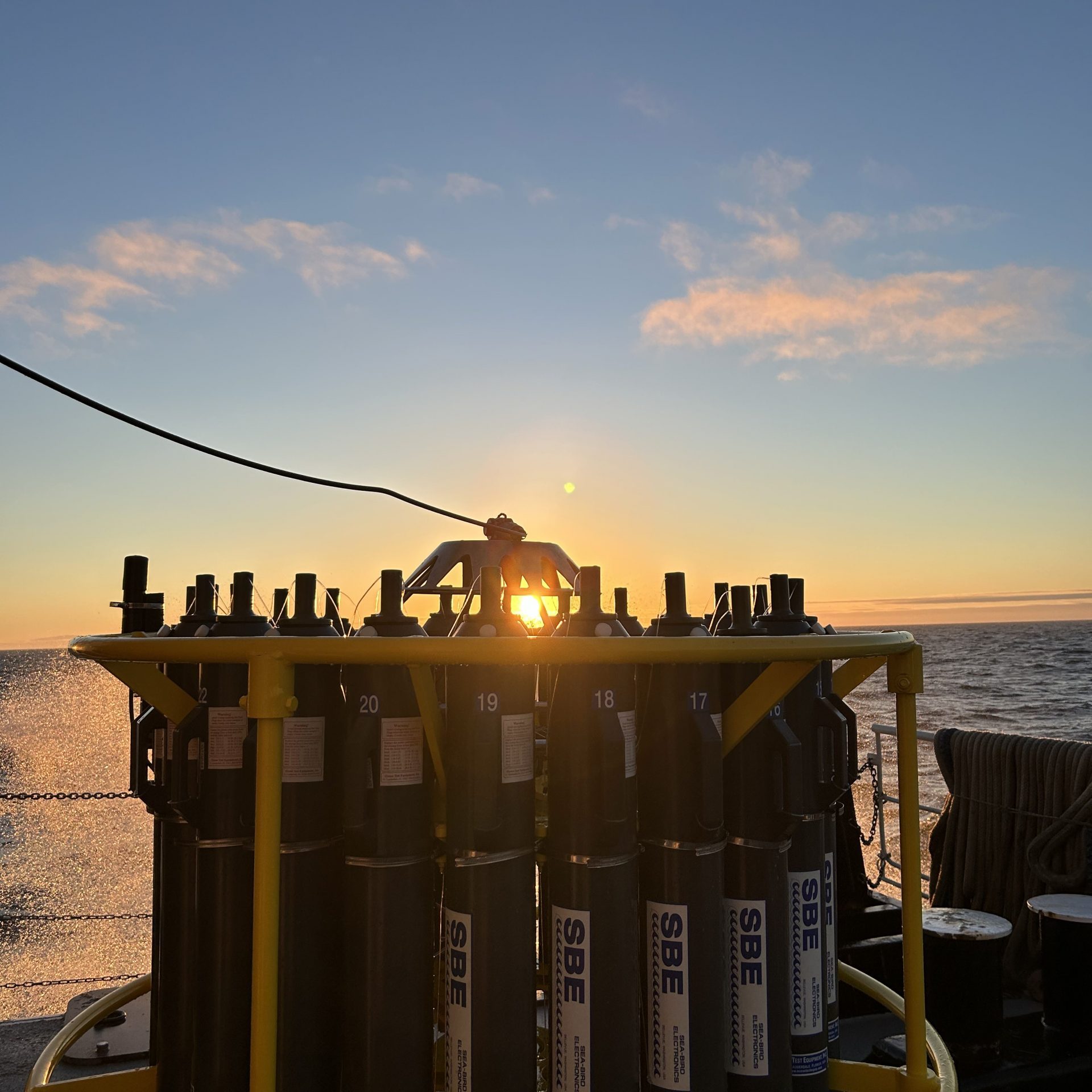 Sunset through the CTD Rosette. Photo Credit Chloe Dean.